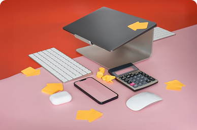 Modern workspace with laptop, calculator and office supplies